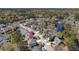 Aerial view showcasing the property's location within a serene neighborhood with mature trees and a pond at 1704 Tolbert Way, Mount Pleasant, SC 29466