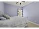 This cozy bedroom includes a queen-sized bed, soft carpeting, and natural light from the windows at 1704 Tolbert Way, Mount Pleasant, SC 29466