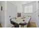 Bright game room with an air hockey table, a window for natural light, and neutral walls at 1704 Tolbert Way, Mount Pleasant, SC 29466