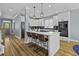 Modern kitchen with stainless steel appliances, a large island, and stylish pendant lighting at 1704 Tolbert Way, Mount Pleasant, SC 29466