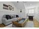 This living room offers a sofa, a coffee table, and an air hockey table for in-home recreation at 1704 Tolbert Way, Mount Pleasant, SC 29466