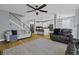 Spacious living room showcasing hardwood floors and a staircase to the second level at 1704 Tolbert Way, Mount Pleasant, SC 29466