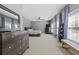 This expansive main bedroom features a ceiling fan, ensuite access, and large windows for ample natural light at 1704 Tolbert Way, Mount Pleasant, SC 29466