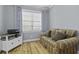Relaxing office space with a comfortable couch, storage, and a window with pleasant light at 1704 Tolbert Way, Mount Pleasant, SC 29466