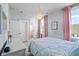 Comfortable bedroom with a connecting bathroom and a large window with views at 1772 Agate Bay Dr, Mount Pleasant, SC 29466