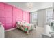 Bright bedroom with decorative pink paneling and two windows with natural light at 1772 Agate Bay Dr, Mount Pleasant, SC 29466