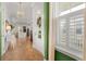 Inviting entryway with hardwood floors, views into an open concept living and kitchen area and a flood of natural light at 1772 Agate Bay Dr, Mount Pleasant, SC 29466