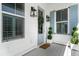 Charming front porch details include a blue front door with a festive wreath and elegant lanterns at 1772 Agate Bay Dr, Mount Pleasant, SC 29466