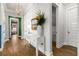 Hallway with console table, decorative plant, and view to multiple rooms at 1772 Agate Bay Dr, Mount Pleasant, SC 29466