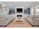 Cozy living room features a fireplace, built-in shelving, and comfortable seating with lots of natural light at 1772 Agate Bay Dr, Mount Pleasant, SC 29466
