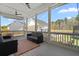 Comfortable screened porch with ceiling fans, outdoor seating, and scenic backyard views at 1772 Agate Bay Dr, Mount Pleasant, SC 29466