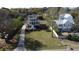 Aerial view of the home showing the long driveway, large front yard, and other houses nearby at 185 5Th Ave, Mount Pleasant, SC 29464