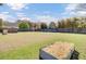 Expansive backyard featuring a wooden fence, lush grass and a raised metal garden, perfect for outdoor enjoyment at 185 5Th Ave, Mount Pleasant, SC 29464