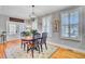 Inviting dining area featuring hardwood floors, natural light, and decorative artwork at 185 5Th Ave, Mount Pleasant, SC 29464