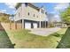 This home boasts a two-car garage, ample parking space and manicured lawn at 185 5Th Ave, Mount Pleasant, SC 29464