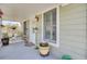 Welcoming front porch with comfortable seating and decorative flowerpots at 185 5Th Ave, Mount Pleasant, SC 29464