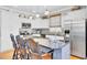 Bright kitchen features a central island with bar seating, stainless steel appliances, and ample cabinet space at 185 5Th Ave, Mount Pleasant, SC 29464