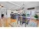 Spacious kitchen and dining area with modern appliances, an island with seating, and hardwood floors at 185 5Th Ave, Mount Pleasant, SC 29464