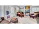 Inviting living room with updated decor, modern shelving and comfortable seating at 185 5Th Ave, Mount Pleasant, SC 29464