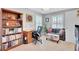 Home office with built in bookshelves and well-lit seating area at 185 5Th Ave, Mount Pleasant, SC 29464