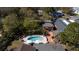Aerial view of the backyard featuring a private pool, lush landscaping, and multiple outdoor seating areas at 2014 Ion Ave, Sullivans Island, SC 29482