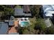 An aerial view showcases this property's private backyard oasis with a sparkling pool and lush landscaping at 2014 Ion Ave, Sullivans Island, SC 29482