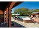 Landscaped backyard featuring a private pool, lounge area, and multiple seating options at 2014 Ion Ave, Sullivans Island, SC 29482