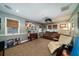 Finished basement media room with a large screen, hardwood floors, neutral walls and built-in speakers at 2014 Ion Ave, Sullivans Island, SC 29482