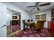 Bedroom with a mirrored closet, wood floors, a ceiling fan, and a vintage-style desk at 2014 Ion Ave, Sullivans Island, SC 29482