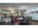 Bright dining room featuring a decorative chandelier, dark wood floors and patterned chairs at 2014 Ion Ave, Sullivans Island, SC 29482
