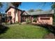 Charming brick home with mature landscaping, a well-manicured lawn and inviting entryway at 2014 Ion Ave, Sullivans Island, SC 29482
