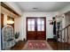 Inviting foyer with beautiful front door, hardwood floors and striking tiled fountain at 2014 Ion Ave, Sullivans Island, SC 29482
