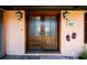 Elegant front entrance featuring double doors, decorative lighting, and classic architectural details at 2014 Ion Ave, Sullivans Island, SC 29482