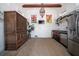 Unique space with kitchenette, stainless steel fridge, custom cabinets, and distinctive decor at 2014 Ion Ave, Sullivans Island, SC 29482