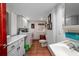 Efficient laundry room with ample storage cabinets, countertop, and washer-dryer at 2014 Ion Ave, Sullivans Island, SC 29482