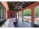 Inviting covered patio with comfortable seating, overlooking the pool, and outdoor lounge area at 2014 Ion Ave, Sullivans Island, SC 29482
