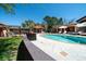 Inviting backyard pool area with lush landscaping and lounge seating for relaxation and enjoyment at 2014 Ion Ave, Sullivans Island, SC 29482
