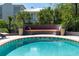 Backyard pool with an outdoor seating area with an in-pool bench and colorful pillows at 2014 Ion Ave, Sullivans Island, SC 29482