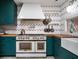 Up close view of professional range with butcher block countertops and herringbone backsplash at 2014 Ion Ave, Sullivans Island, SC 29482