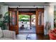 Indoor-outdoor view through sliding glass doors, showcasing a deck and swimming pool in the backyard at 2014 Ion Ave, Sullivans Island, SC 29482