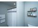 Tastefully decorated bathroom featuring a shower with decorative shelving, combining style with everyday functionality at 204 Torslanda Ln, Summerville, SC 29486
