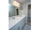 Bright bathroom featuring a double sink vanity with quartz countertops, complemented by neutral tile flooring at 204 Torslanda Ln, Summerville, SC 29486