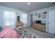 Bright bedroom with a vanity table, rug, and furniture arranged to maximize natural light and space at 204 Torslanda Ln, Summerville, SC 29486