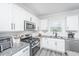 Bright kitchen featuring stainless appliances, granite countertops, subway tile backsplash, and white cabinets at 204 Torslanda Ln, Summerville, SC 29486