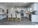Large kitchen island with seating, granite countertops, stainless steel appliances, and white cabinetry at 204 Torslanda Ln, Summerville, SC 29486