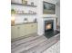 Living room showcasing built-in cabinets, fireplace, and grey vinyl flooring at 204 Torslanda Ln, Summerville, SC 29486