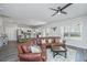 Spacious living room with lots of light, kitchen views, and large leather sofa at 204 Torslanda Ln, Summerville, SC 29486