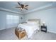 Bright main bedroom featuring a comfortable bed, neutral colors, and cozy decor at 204 Torslanda Ln, Summerville, SC 29486