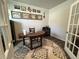 Inviting office space featuring hardwood floors, an antique desk, and glass French doors for natural light at 204 Torslanda Ln, Summerville, SC 29486