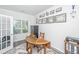 Well-lit home office with hardwood floors, an antique desk, and many decorative certificates on the wall at 204 Torslanda Ln, Summerville, SC 29486